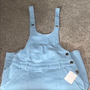 Blue overall/skirt jumper with pockets, size 2 NWT